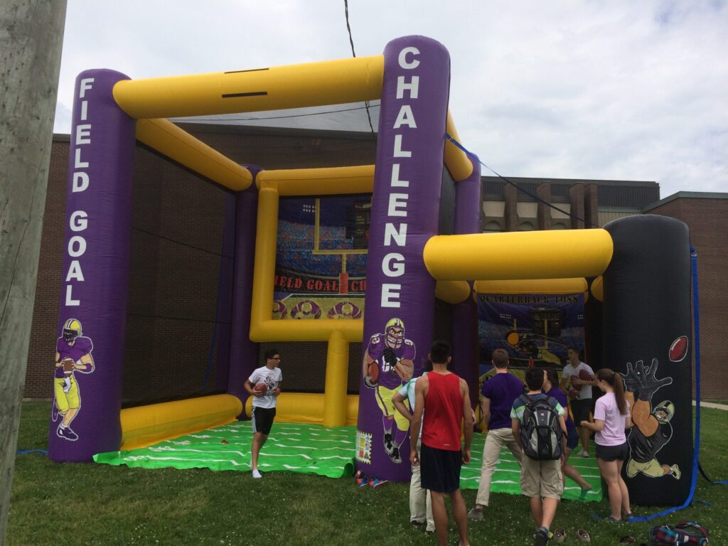 Inflatable field goal challenge and football toss at outdoor event