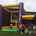 Inflatable field goal challenge and football toss at outdoor event