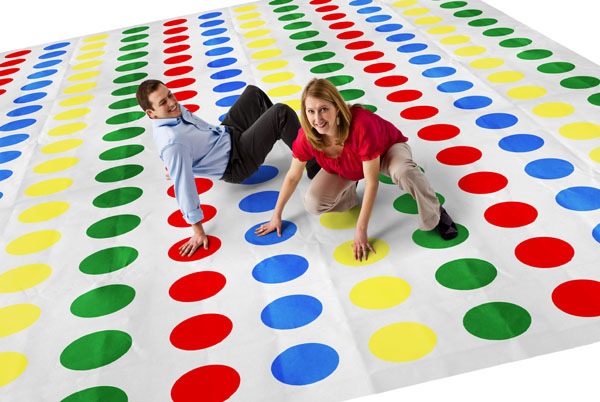 Giant Twister game with smiling man and woman