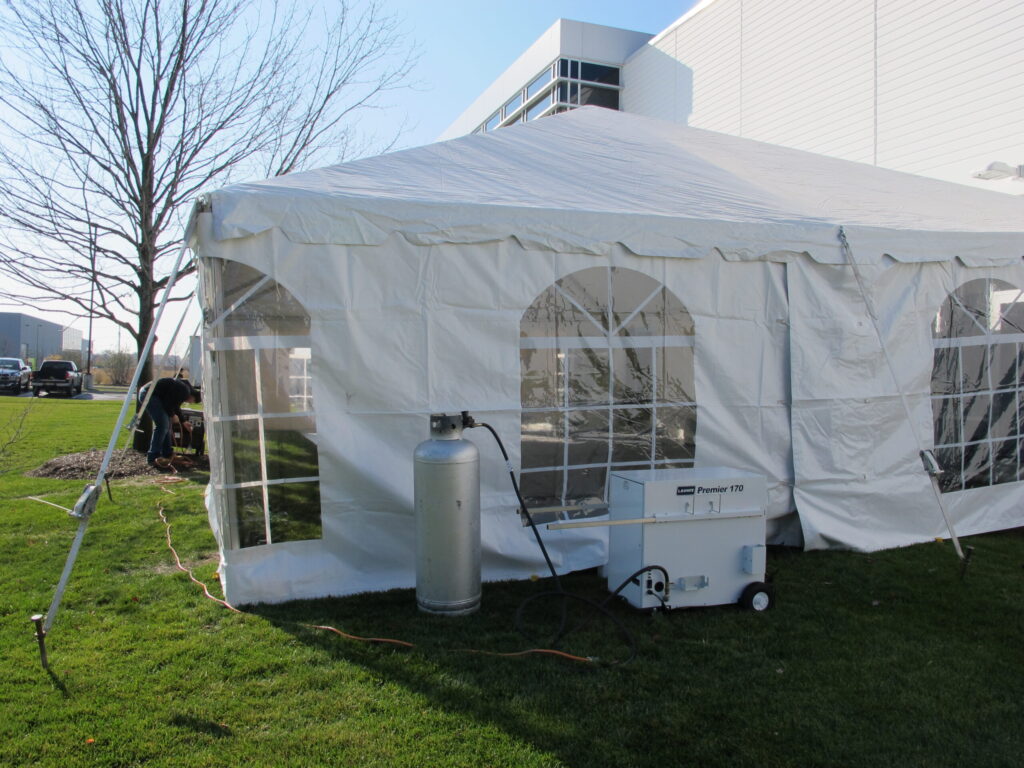 White rental tent with a heater