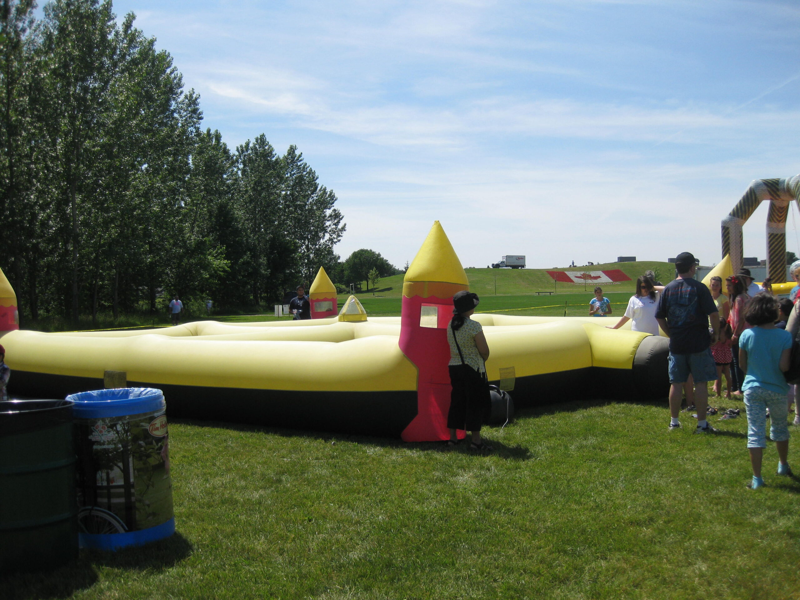 Giant Yellow Maze inflatable maze at outdoor event